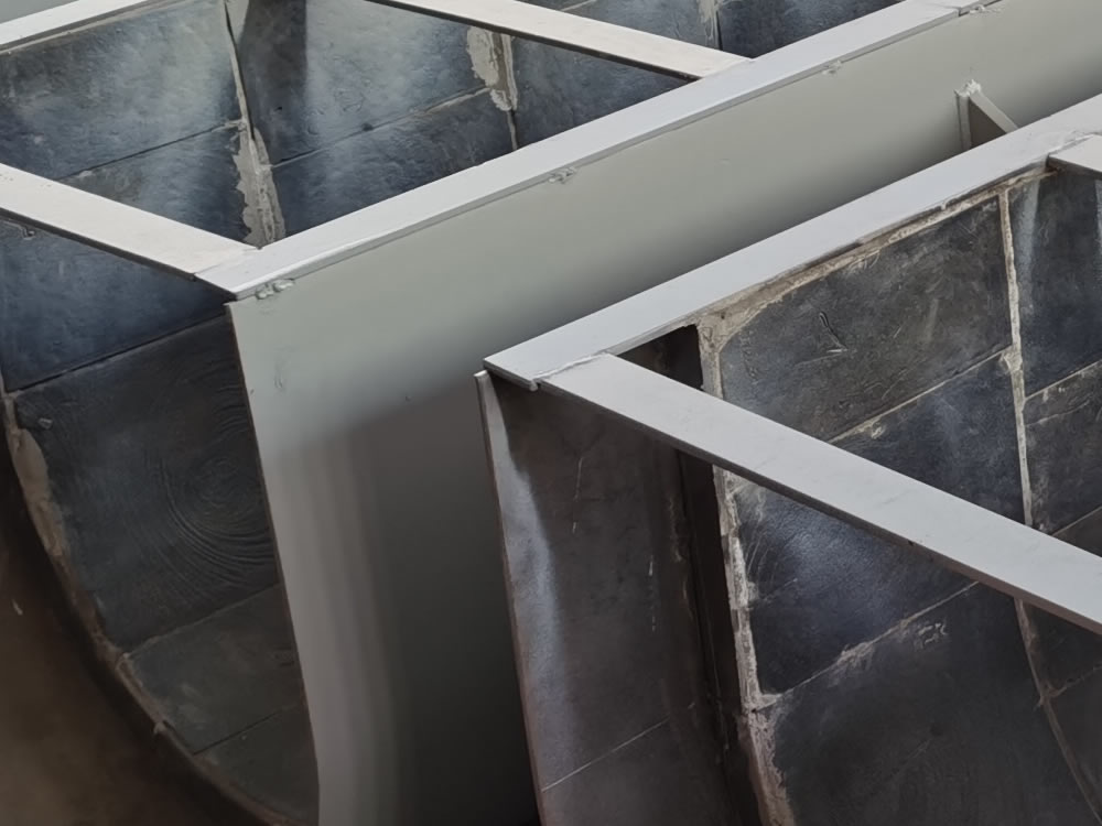 Steel-lined composite cast basalt chute